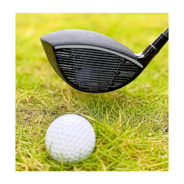 Golf driver with carbon fibre shaft resting on grass – Embrace Golf Australia